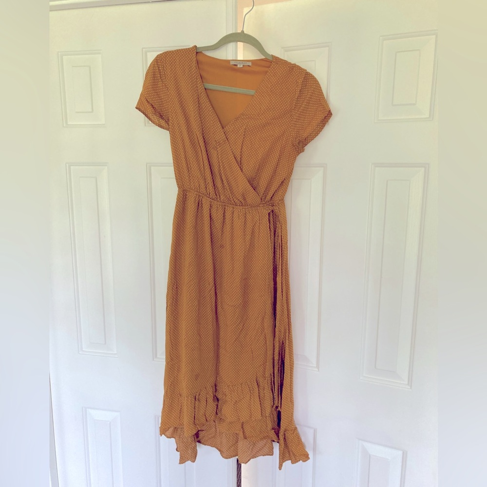 Polagram “the castleford ruffle wrap dress in mustard mini dot”